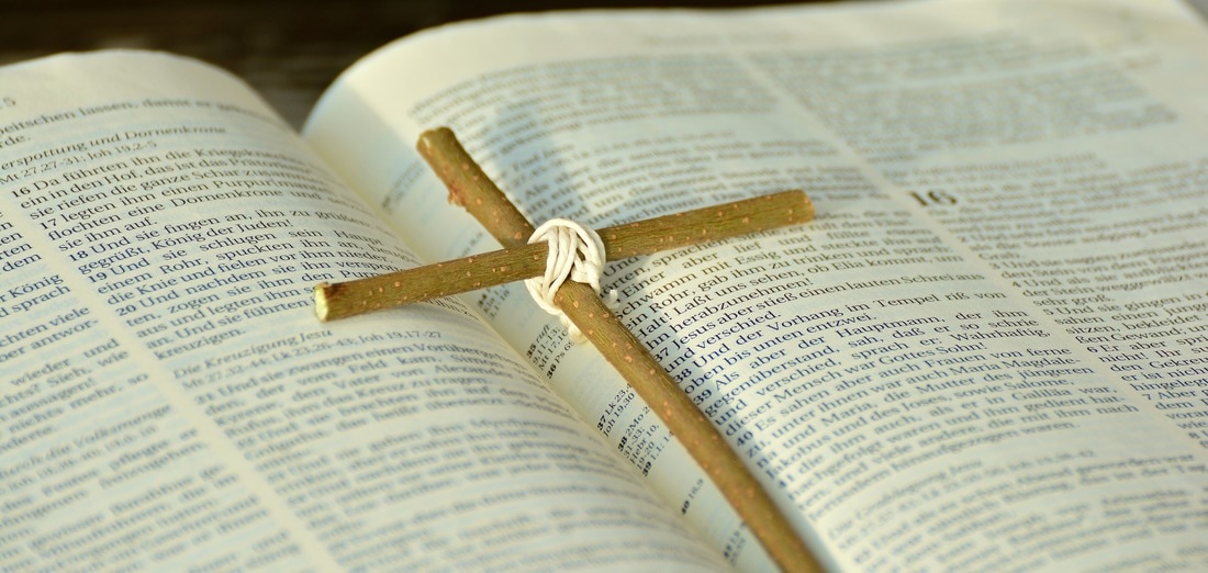 opened bible with cross