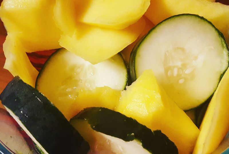 sliced mango and cucumbers