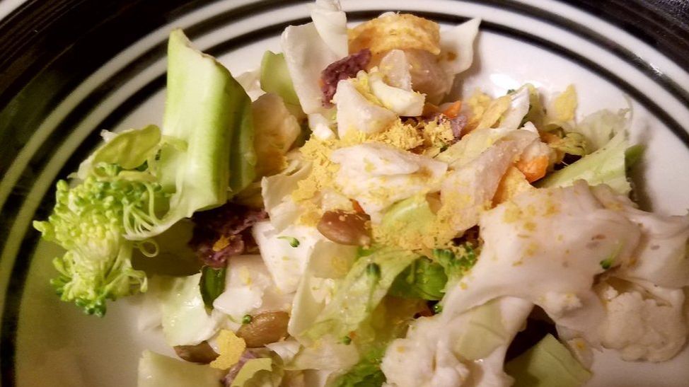 Salad topped with Bragg Nutritional Yeast